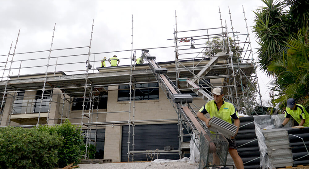 Digital home claims - front of house surrounded by scaffolding